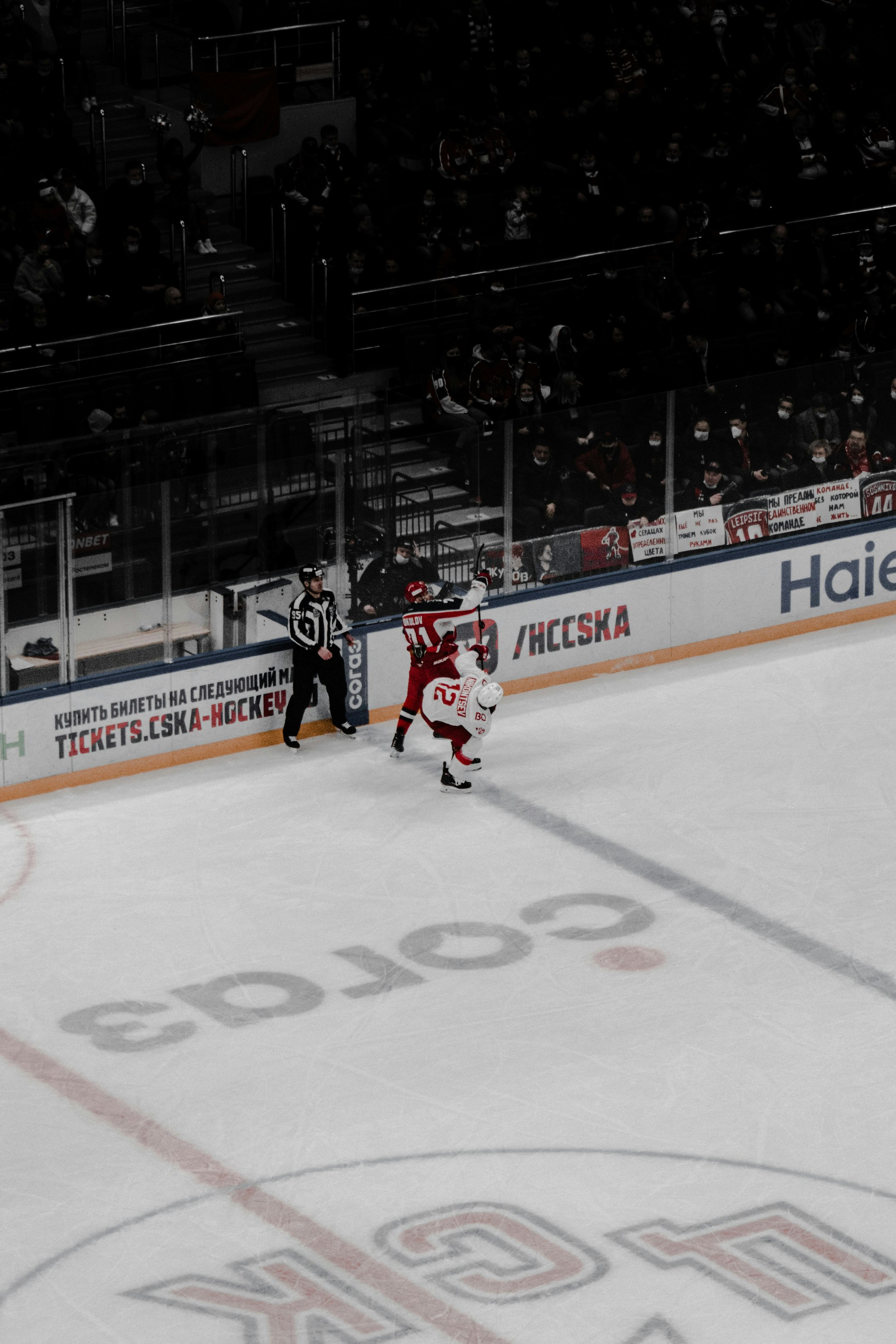 people playing ice hockey on ice stadium